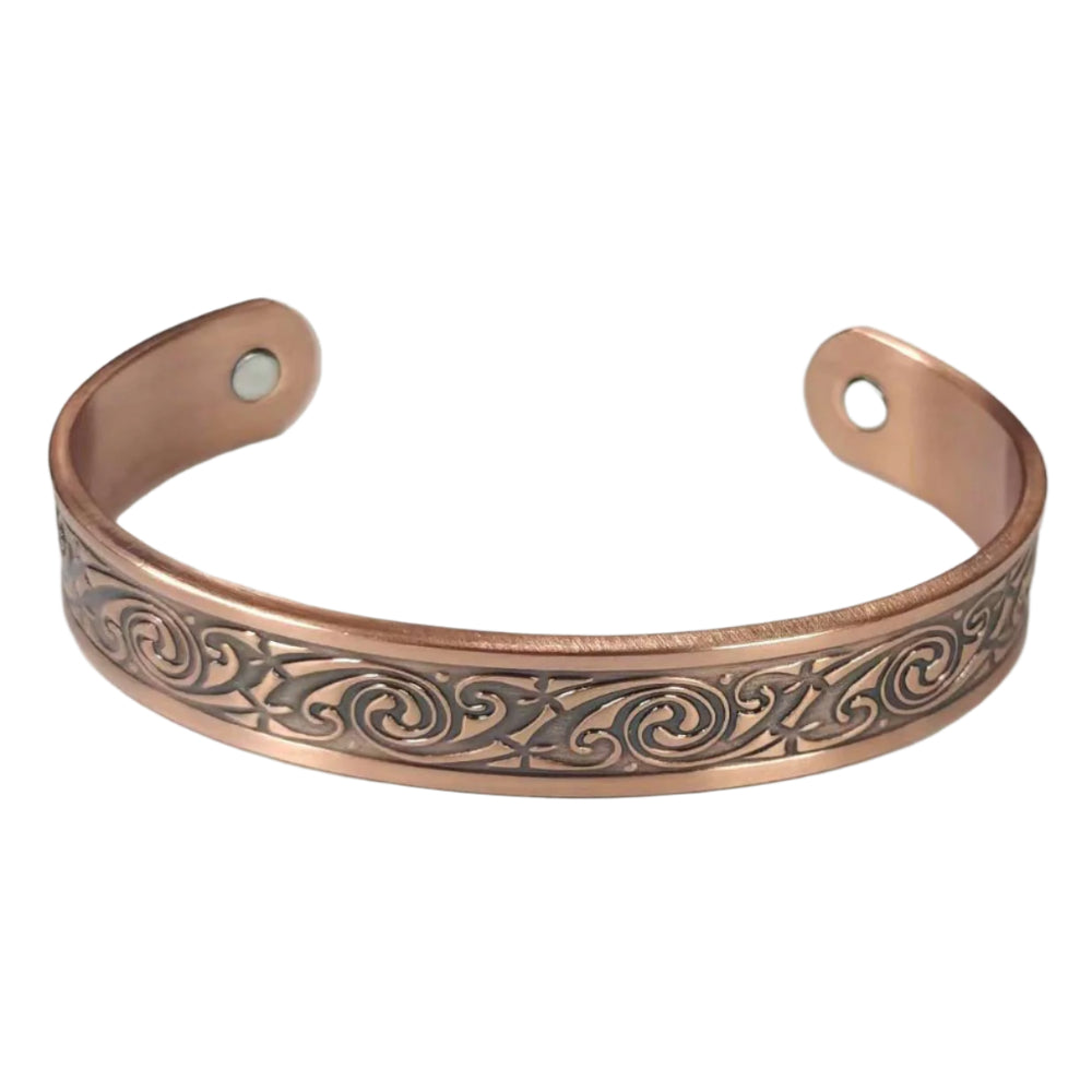 magnetic copper bracelet with a koru swirl pattern